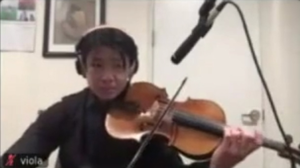 Stanford orchestra member using Jacktrip and recorded on Zoom